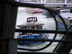 Barge behind bridge