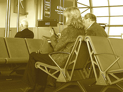 Mature blond in high heeled Cowgirl boots -  Brussels airport - October 19th 2008  - Sepia
