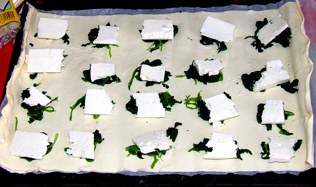 Filo dough filled with goat cheese and spinach leaves