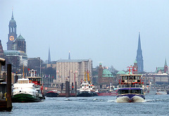 Hamburg Skyline with ferry and some tugboats