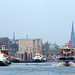 Hamburg Skyline with ferry and some tugboats