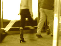 Mature blond in hammer heeled boots with a calve cleavage-  Aéroport de Bruxelles -  19-10-2008  - Sepia
