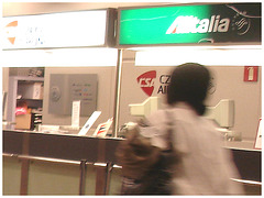 Air Italia black Lady in stiletto boots - Brussels airport
