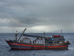 Burmese fishing boat crossing the route