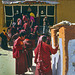 Pilgrims step in the Toling Monastery