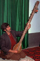 Afghanian musician plays his instrument