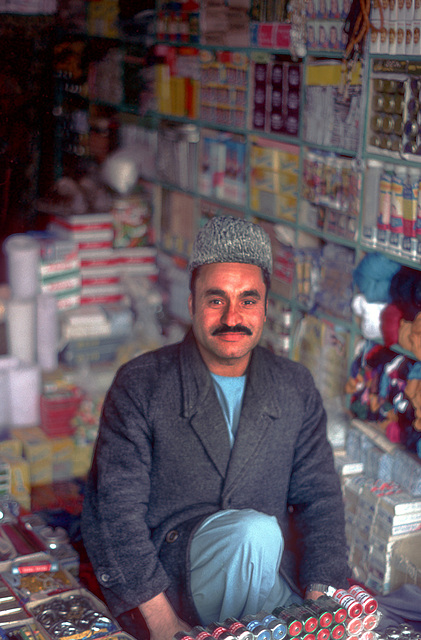 Vendor offers his products in his ordinary shop