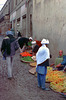 Fruit vendors offer their products after the rain