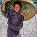 Young boy using his basket as an hat