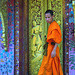Monk exits Wat Xieng Thong main temple