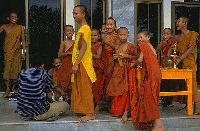 Laotian monks in a monastery beside the Mekong