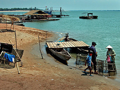 Fisher on the Mekong riverside