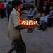 Boy brings new lighted butter lamps