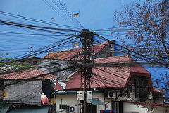Blue wall and cable chaos