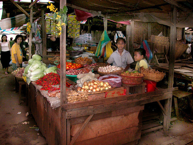 Vegetable vendor girls at the market in Pakse
