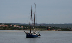 Algarve, sailing ship at the mouth of the small river Boina