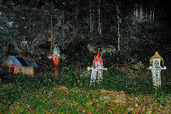 Spirit houses at the cave entrance