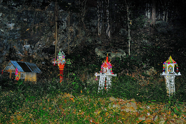 Spirit houses at the cave entrance