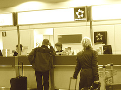 Star Alliance blonde mature in Dominatrix Boots - Brussels airport  / 19-10-2008 - Sepia with photofilter