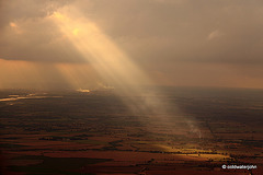 Aerial - Sunbeam breaking through the cloud cover on approach to Southend