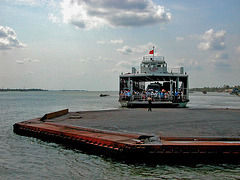 Boarding the ferry to across the Mekong branch