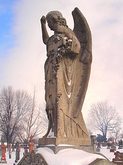 Regard intime sur Ange à la croix /  Intimate glance at the Angel holding the cross-  Hometown cemetery -  Dans ma ville - 25 Janvier 2009.