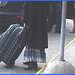 Longue jupe avec bottes à talons moyens  /  long skirt and hammer heeled leather boots -Aéroport de Montréal / Montreal airport -- 18 Octobre 2008
