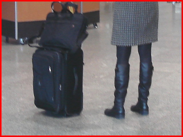 Blond in flat boots and checked skirt /  Blonde en bottes SS et jupe en damiers- Aéroport de Montréal.