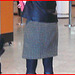 Blonde in flat boots and checked skirt /  Blonde en bottes SS et jupe en damiers- Aéroport de Montréal.