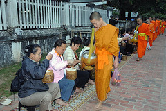 Monks get food donation in early morning