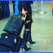 Très séduisante Dame mature en Bottes de Dominatrice - Mature Lady in tremendous Dominatrix Boots- PET Montreal airport-À l'intérieur - Bottes et valises /Photofiltre