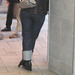 Redhead sexy Lady in hammer heeled boots and rolled-up jeans /  Bottes à talons marteaux avec jeans retroussées - Aéroport de Montréal.  18 octobre 2008