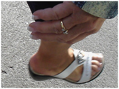 Blond mature in white sexy strappy sandals-  Dame blonde du bel âge en sandales blanches à courroies -  Aéroport de Montréal.
