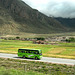 Modern tourist bus runs beside the Tibet train