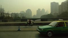 Chengdu taxi, and an e-scooter