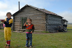 Nomads kiddies at her block hut home