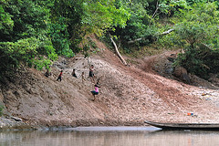 Life scene with playing children at the riverbank