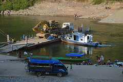 The ferry boat carries a heavy excavator with grab