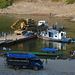 The ferry boat carries a heavy excavator with grab