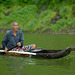 Fisherman goes out in a dugout canoe