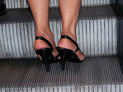 big feet at the escalator