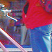 Direkten blond biker in red with jeans and white sneakers /  Suédoise blonde à vélo en jeans et espadrilles blanches -  Ängelholm / Sweden - Suède - 23-10-2008 - Photofiltered cracks /  Craquelures photofiltrées
