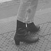 Street corner curly Mature Lady in sexy high-heeled boots and jeans /  Dame mature aux cheveux bouclés en bottes à talons hauts et jeans -  Copenhage, Danemark.  19-10-2008- N & B