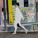 Direkten hatter in chunky heeled shoes and sexy skirt /  Suédoise à chapeau en jupe sexy et souliers à talons trapus /   Ängelholm /  Suède - Sweden.  23/10/2008 - Négatif RVB postérisé
