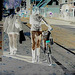 Cycliste en bottes à talons hauts / Walking Swedish biker in jeans & high-heeled boots at her cell phone - Ängelholm  / Suède - Sweden.  23-10-2008 - Négatif