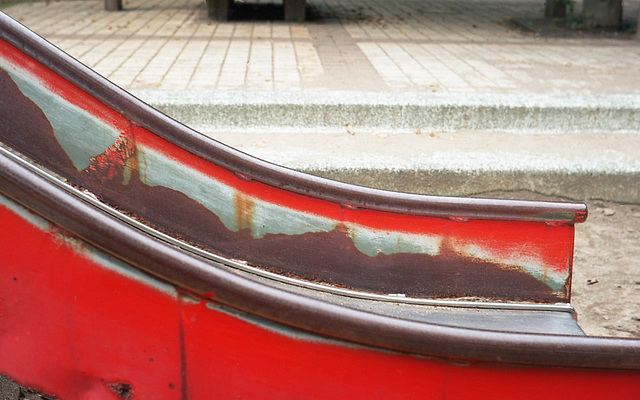 Worn-out paint of a slide