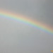 Rainbow slicing through the sky . .