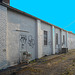 Façade graffitienne / Graffitis façade - New-Brunswick, New-Jersey. USA - 21 juillet 2010. - Avec ciel bleu photofiltré