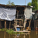 Poor housing at the Khlong Si water side