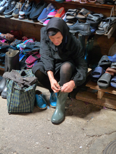 Kutaisi- Trying on a New Pair of Boots at the Market
